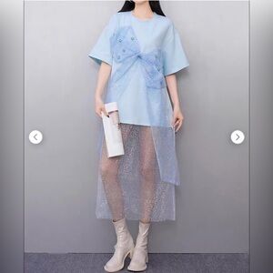 Elegant Light Blue t-shirt Dress with Sheer Sequin Overlay and mesh bow accent.